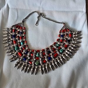 Silver, turquoise, and red jasper Aztec necklace.